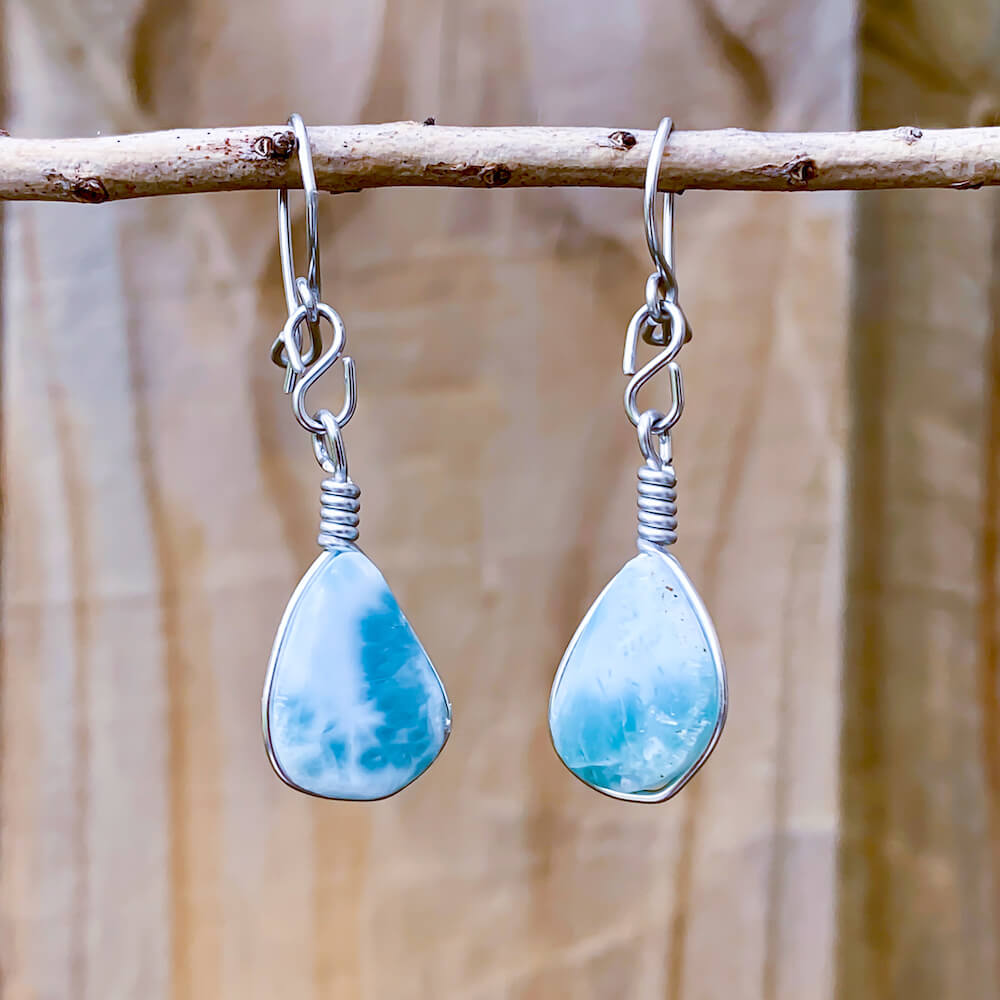 This lovely, rare and spectacular mineral gem called Larimar is a blue pectolite found in the Dominican Republic. Shop Genuine Blue Larimar Earrings set in Sterling Silver at Magic Crystals. We carry Larimar Teardrop Stone, Sterling Caribbean Larimar Earrings, Gift For Her, Gemstone Earrings and Dangle earrings.