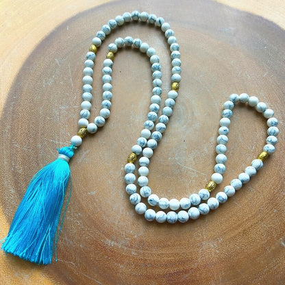 Shop beautiful hand crafted Natural Gemstone Mala Necklace - Prayer Beads at Magic Crystals. High quality Prayer Beads, Including Lapis Lazuli, Larvikite, Snowflake Obsidian, Howlite, Black Agate, Picture Jasper, Red Jasper, and Amethyst. Handcrafted with 108 beads, can be worn as a necklace or bracelet.