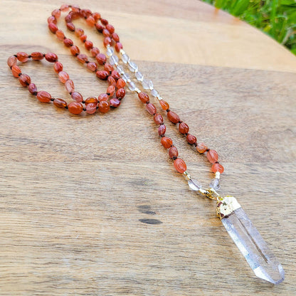 Shop Red Agate Stone Single Point Mala Necklace. Our No Negativity Red Agate Mala is hand-knotted with the finest Red Agate nugget chips. Magic Crystals helps with cutting cords with persons that have a negative influence on a person wearing. Each bead is mindfully knotted