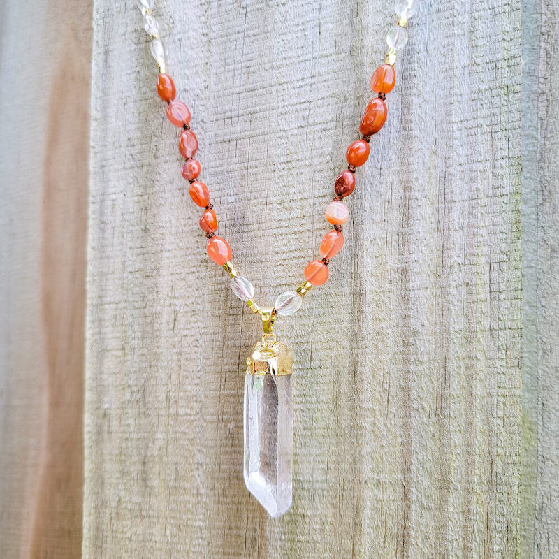 Shop Red Agate Stone Single Point Mala Necklace. Our No Negativity Red Agate Mala is hand-knotted with the finest Red Agate nugget chips. Magic Crystals helps with cutting cords with persons that have a negative influence on a person wearing. Each bead is mindfully knotted