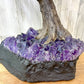 Looking for a large gemstone tree? Shop at Magic Crystals for a 17" - LARGE Multi Gemstone Tree on Amethyst Base with Authentic Crystals. Handmade Gemstone Tree w/Amethyst base. Druzy Amethyst Base. Materials Carnelian, Sodalite, Red Agate, Citrine, Green aventurine, Amethyst, Clear quartz, Rose Quartz and more.