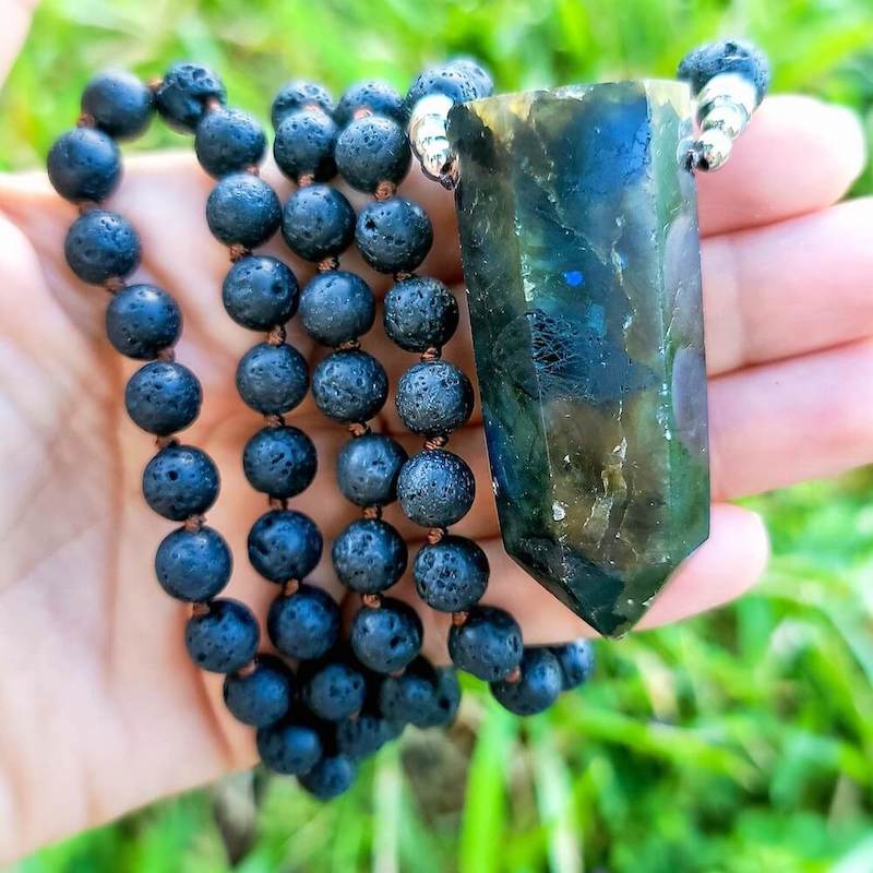 Shop Crystal Necklaces. Labradorite and Lava Mala Necklace - Handcrafted for Chakra Energy at Magic Crystals. This Mala Stone is made of Black Lava Stone. FREE SHIPPING available. Black Lava Stone is known for its grounding qualities, it’s wonderful for calming the emotions. FREE SHIPPING available.