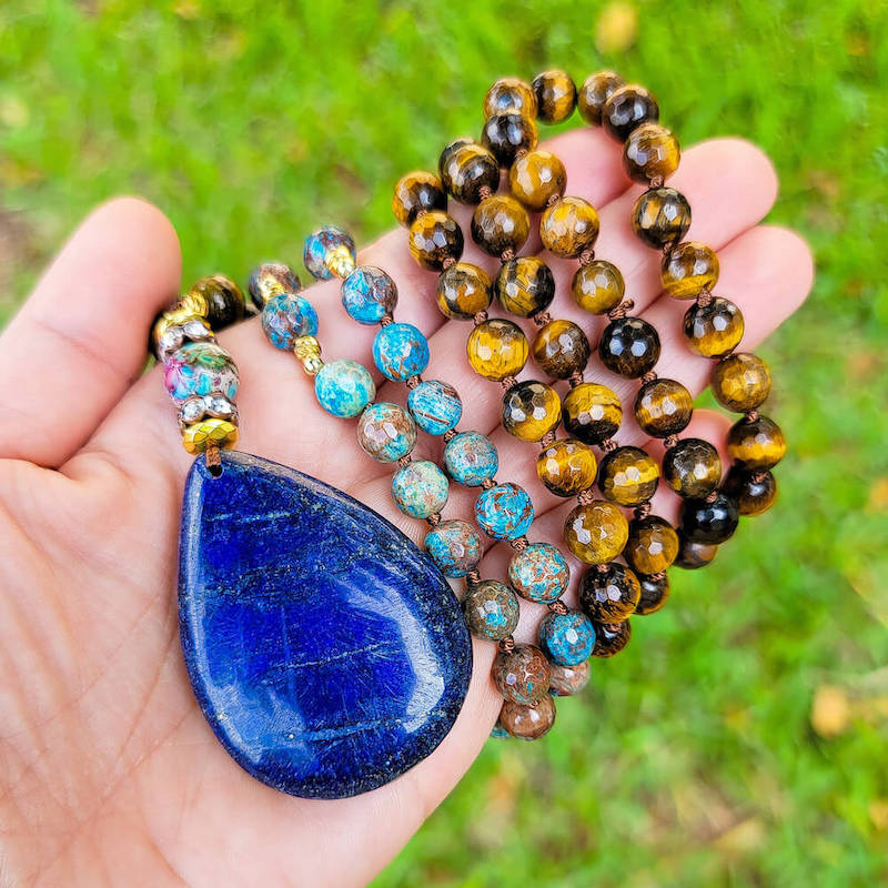 Shop beautiful hand-crafted Tiger Eye and Lapis Lazuli Stone Mala Necklace. High-quality Blue Prayer Beads at Magic Crystals. Throat Chakra Healing Necklace. Inspiring People To Practice Yoga and Meditation. Check out our Mala Necklaces Collection. Mala beads are a string of beads that are used in a meditation practice