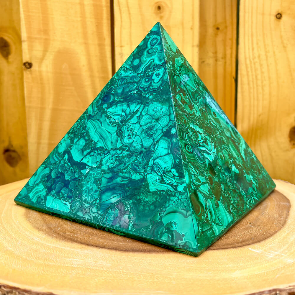 Experience the power and energy of genuine Congo malachite with this beautiful large pyramid. Handcrafted to perfection, this malachite pyramid will fill your space with energy and positivity. Unlock your spiritual potential with this one-of-a-kind malachite pyramid!