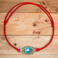 Light-Blue-Evil-Eye-Red-String-Bracelet. Shop at Magic Crystals for Protection. The Red String Bracelet has been worn throughout history in many cultures as a symbol of protection, faith, and good luck and acts as a shield from negativity and actually has many positive effects. In quite a few cultures a red string bracelet is believed to have magical powers.