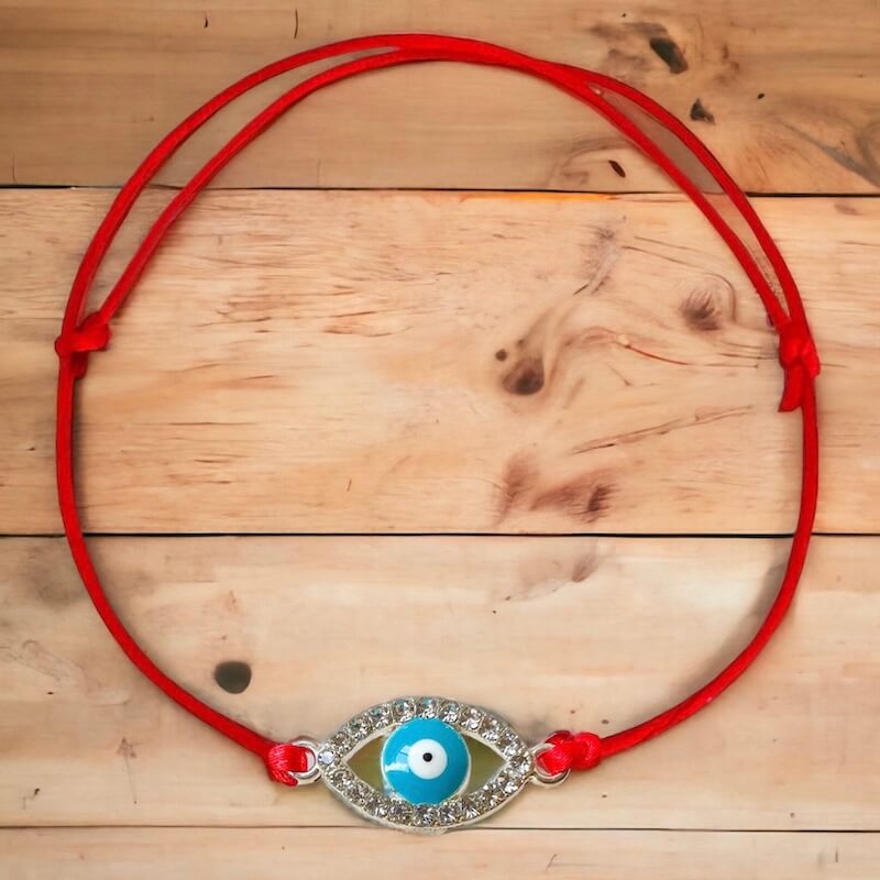 Light-Blue-Evil-Eye-Red-String-Bracelet. Shop at Magic Crystals for Protection. The Red String Bracelet has been worn throughout history in many cultures as a symbol of protection, faith, and good luck and acts as a shield from negativity and actually has many positive effects. In quite a few cultures a red string bracelet is believed to have magical powers.