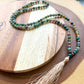 Shop beautiful hand crafted Natural Gemstone Mala Necklace - Prayer Beads at Magic Crystals. High quality Prayer Beads, Including Lapis Lazuli, Larvikite, Snowflake Obsidian, Howlite, Black Agate, Picture Jasper, Red Jasper, and Amethyst. Handcrafted with 108 beads, can be worn as a necklace or bracelet.