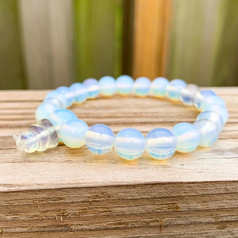 Find the best selection of Opalite Stone Mala Bracelet - Natural Bead Opal Gemstone Bracelet at Magic Crystals. Opalite meaning stabilizes mood swings and helps in overcoming fatigue. Opalite bracelet, opalite crystal bracelet. 7-8 inch bracelets crystals opalite. Opal stone bracelet. Opalite Jewelry with FREE SHIPPING