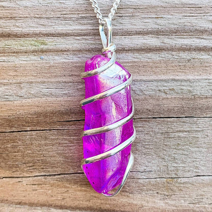 Looking for Point Natural Aura Quartz Jewelry? Magic Crystals carries a variety of Aura Quartz Spiral Wrapped Necklace. Quartz Crystal Point necklace. Wrap Necklace for Men Women. Rose, Angel, Purple, Blue Aqua, Sunshine, Ruby, Rainbow, Sunshine, Green Apple, Deep Blue, Tangerine, Deep Rose Aura Quartz