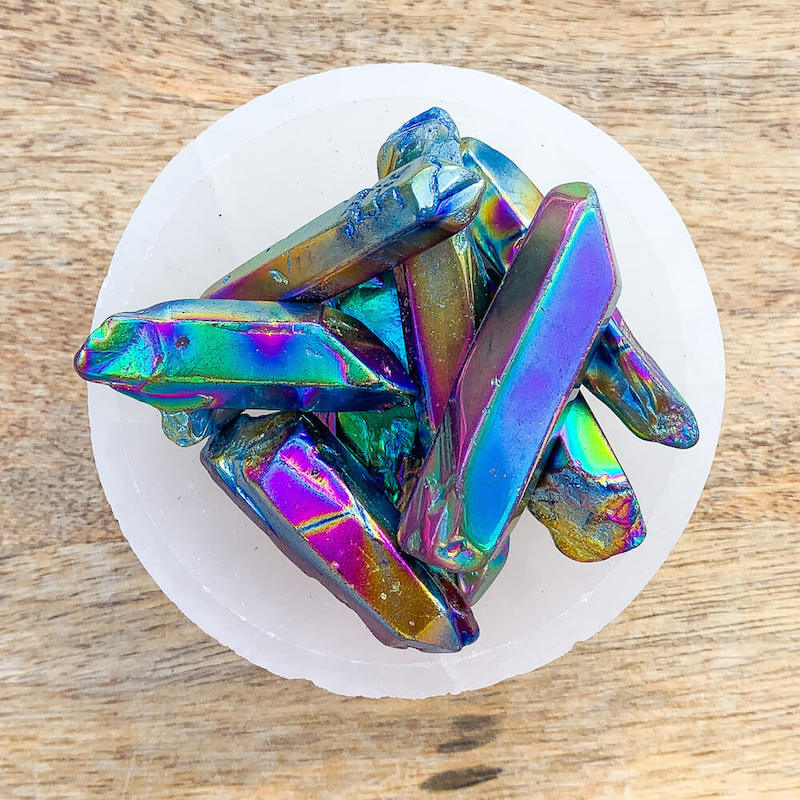 Looking for Rainbow Aura Quartz Crystal Polished Point Wand ? shop at Magic Crystals for double-terminated aura quartz polished wands. Raw crystal Aura, Quartz Point, Titanium Aura Quartz Crystal, Great quality Titanium, Rainbow Aura , Crystal Aura, healing crystals and stones.