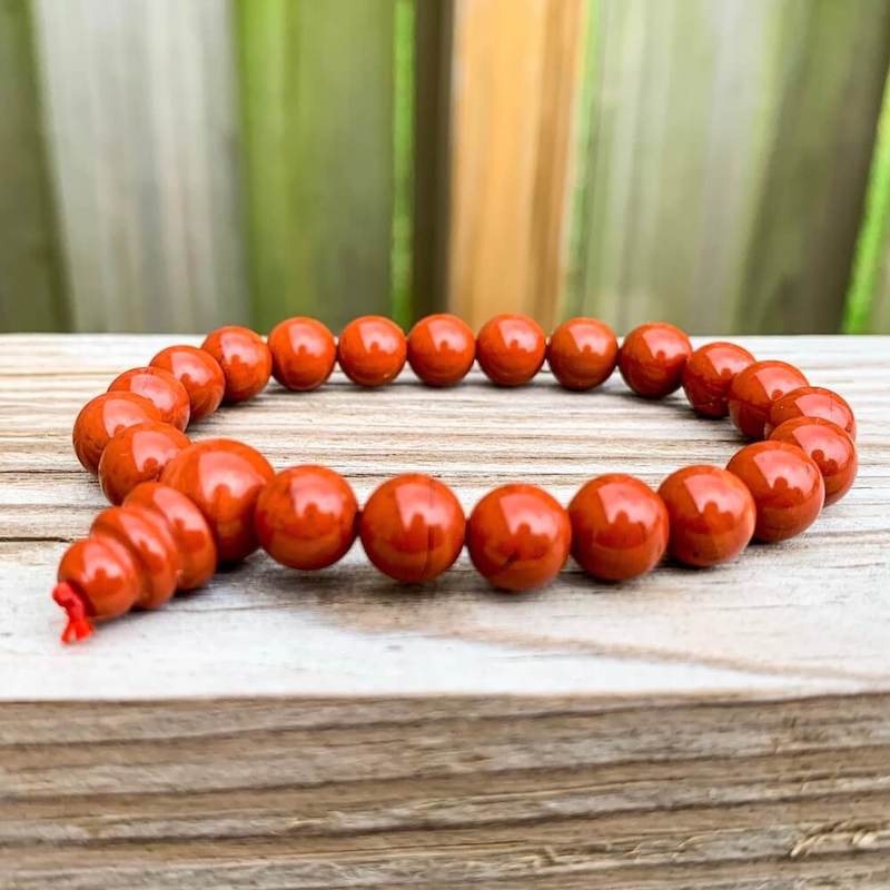 Looking for Red Jasper Mala Beaded Bracelet - Red Jasper Jewelry? Shop at Magic Crystals for Natural Red Jasper Unisex Elastic Bracelet. Red jasper is a stone of physical strength, a vitality that can help with the stabilization of one’s energy. FREE SHIPPING available. Natural Healing Gemstone Bracelet.
