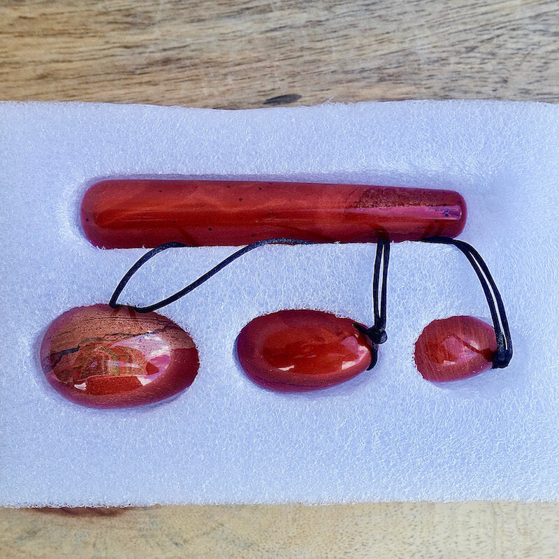 Red-Jasper-Yoni Eggs Set and Massage Wand. These Natural Stone Yoni Egg Set and Massage Wand from Magic Crystals help you build an intimate connection with your body. Polished yoni egg crystals and wand are drilled available in Black Onyx,  Opalite, Unakite, Nephrite Jade, tiger Eye, Clear Quartz, Red jasper, Aventurine, Amethyst, Rose Quartz