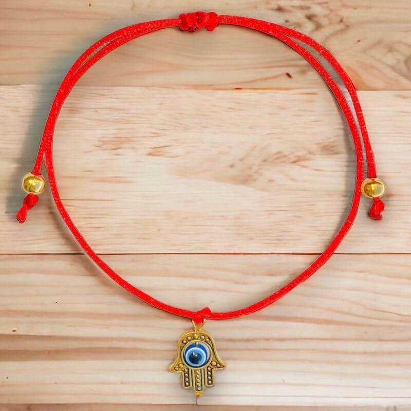Golden-Hamsa-Eye-Bracelet.Shop at Magic Crystals for Protection. The Red String Bracelet has been worn throughout history in many cultures as a symbol of protection, faith, and good luck and acts as a shield from negativity and actually has many positive effects. In quite a few cultures a red string bracelet is believed to have magical powers.