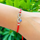 Infinity-Sign-Golden-Blue-Eye-Red-String-Bracelet. Shop at Magic Crystals for Protection. The Red String Bracelet has been worn throughout history in many cultures as a symbol of protection, faith, and good luck and acts as a shield from negativity and actually has many positive effects. In quite a few cultures a red string bracelet is believed to have magical powers.