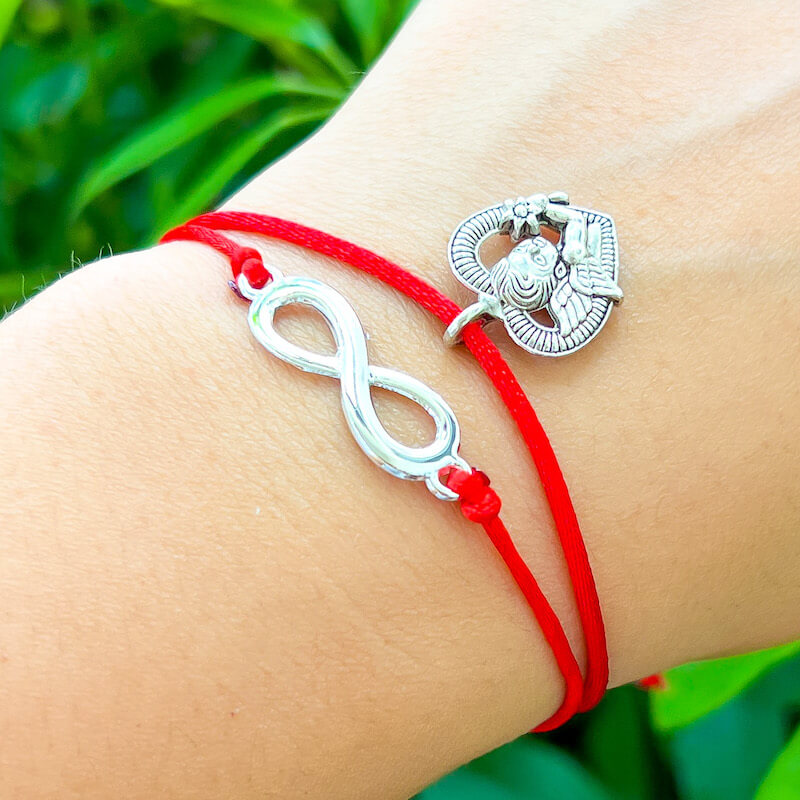 Infinity-Red-String-Bracelet. Shop at Magic Crystals for Protection. The Red String Bracelet has been worn throughout history in many cultures as a symbol of protection, faith, and good luck and acts as a shield from negativity and actually has many positive effects. In quite a few cultures a red string bracelet is believed to have magical powers.