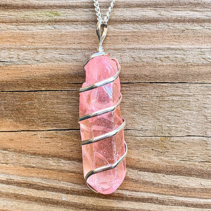 Looking for Point Natural Aura Quartz Jewelry? Magic Crystals carries a variety of Aura Quartz Spiral Wrapped Necklace. Quartz Crystal Point necklace. Wrap Necklace for Men Women. Rose, Angel, Purple, Blue Aqua, Sunshine, Ruby, Rainbow, Sunshine, Green Apple, Deep Blue, Tangerine, Deep Rose Aura Quartz