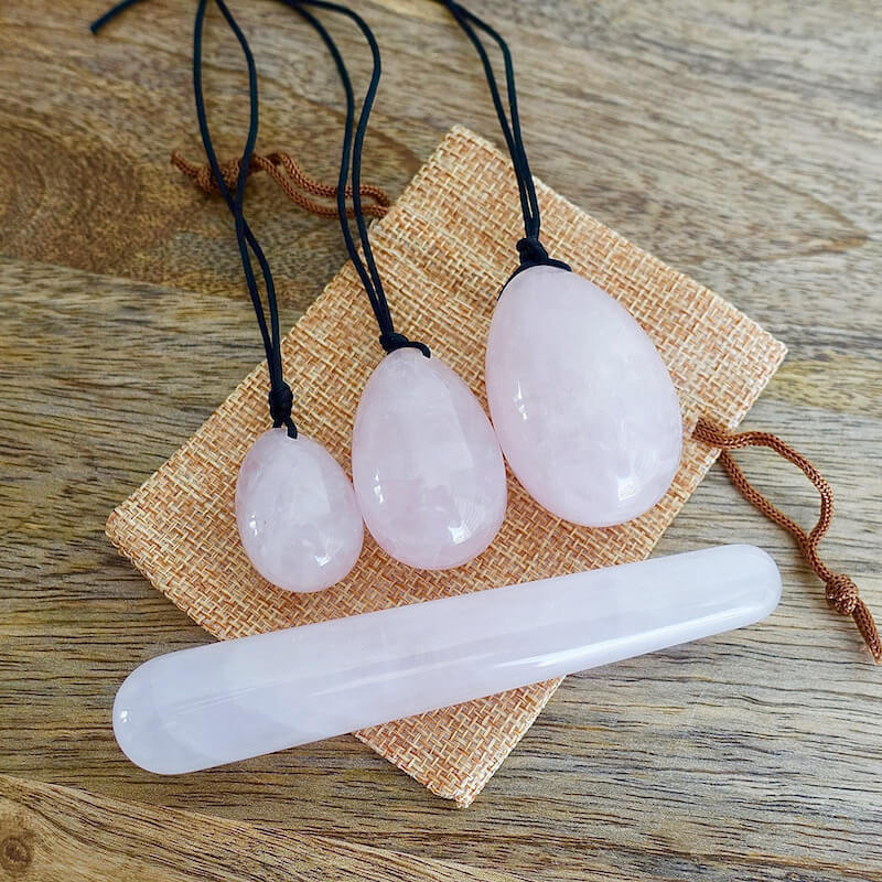 Rose-Quartz-Yoni Eggs Set and Massage Wand. These Natural Stone Yoni Egg Set and Massage Wand from Magic Crystals help you build an intimate connection with your body. Polished yoni egg crystals and wand are drilled available in Black Onyx,  Opalite, Unakite, Nephrite Jade, tiger Eye, Clear Quartz, Red jasper, Aventurine, Amethyst, Rose Quartz