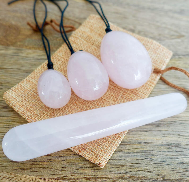 Rose-Quartz-Yoni Eggs Set and Massage Wand. These Natural Stone Yoni Egg Set and Massage Wand from Magic Crystals help you build an intimate connection with your body. Polished yoni egg crystals and wand are drilled available in Black Onyx,  Opalite, Unakite, Nephrite Jade, tiger Eye, Clear Quartz, Red jasper, Aventurine, Amethyst, Rose Quartz