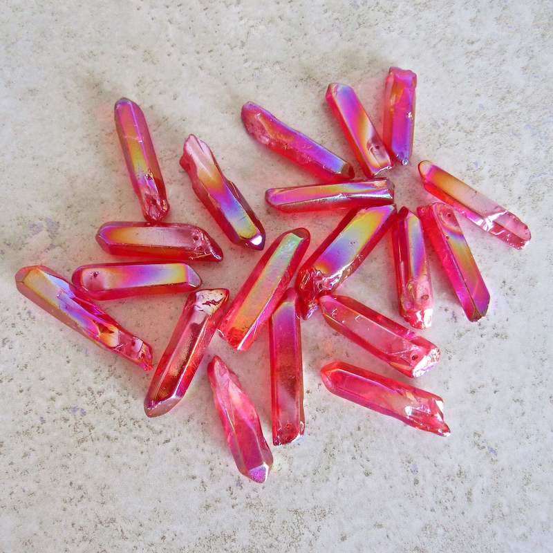 Looking for Rose Aura Points, Ruby Quartz Point? Shop at Magic Crystals for a variety of Aura Quartz Crystal Ruby Jewelry. Aura Quartz Crystal point perfect for healing. Raw Ruby Aura Quartz Crystal Necklace, Healing Gemstone, Ruby Aura Quartz Pendant. Raw Crystal Point Pendant Necklace, Wrap Necklace for Men Women