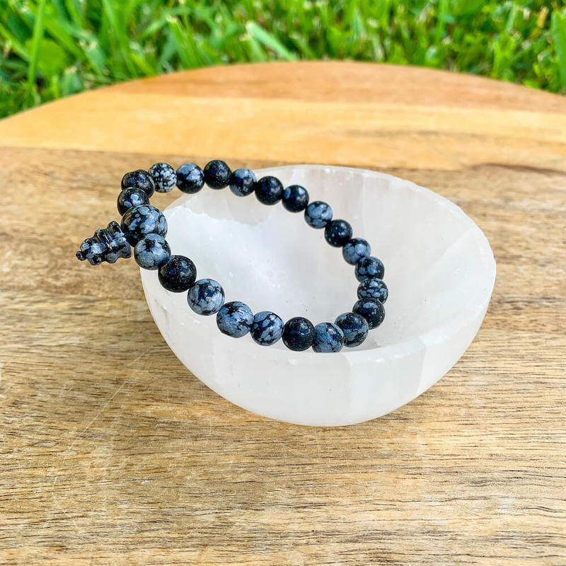 Looking for a Snowflake Obsidian Mala bracelet? Shop at Magic Crystals for the best quality snowflake jewelry. We have 8 mm and 6mm Round Bracelet Stretchy String bracelets for men and women. Healing Crystal Bracelet, Gemstone Bracelets, Bracelets for Women, Fathers Day and Mothers Day Gift, Reiki Jewelry.