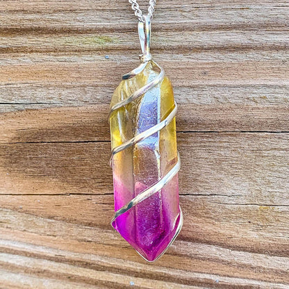 Looking for Point Natural Aura Quartz Jewelry? Magic Crystals carries a variety of Aura Quartz Spiral Wrapped Necklace. Quartz Crystal Point necklace. Wrap Necklace for Men Women. Rose, Angel, Purple, Blue Aqua, Sunshine, Ruby, Rainbow, Sunshine, Green Apple, Deep Blue, Tangerine, Deep Rose Aura Quartz