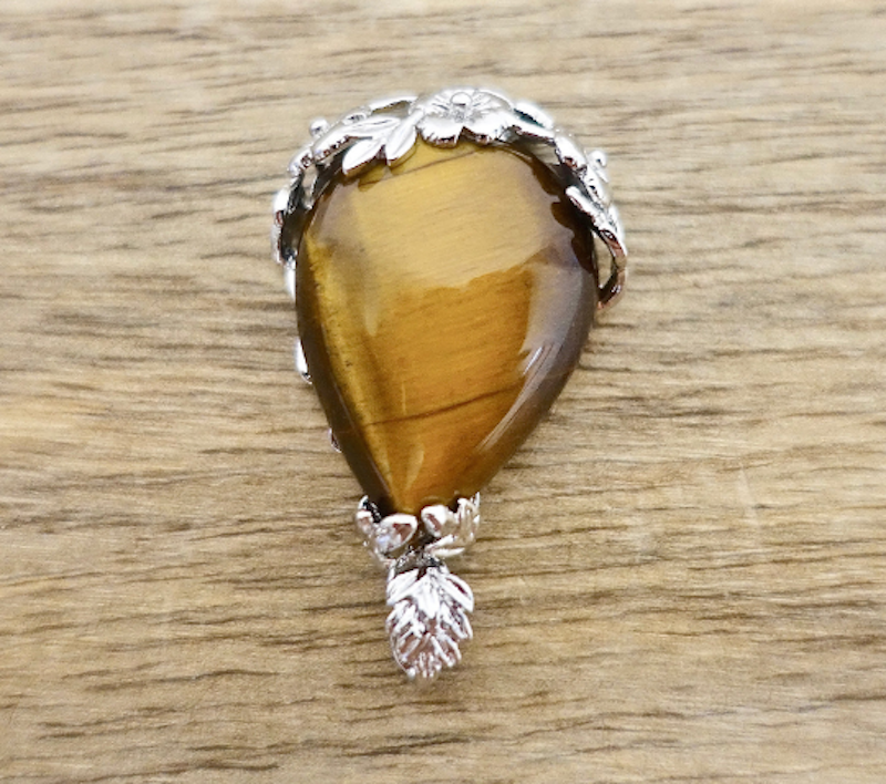 Tiger Eye Stone Pendant Handmade Crystal Necklace from MagicCrystals. High quality yellow tiger eye. Find a wide variety of yellow tiger eye jewelry. Handmade Tiger eye pieces for mother's day, Christmas, halloween, gift. Yellow Tiger Eye Pendant Necklace