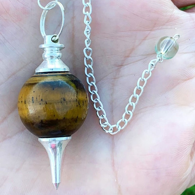 Tiger-Eye Sphere Pendulum. Find Tiger-Eye   Sphere Pendulum - Tiger-Eye Pendant crystal pendulum dowsing when you shop at Magic Crystals. Yellow and Brown Pendulum.