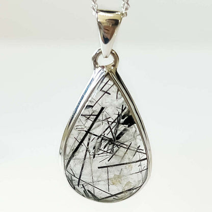 Tourmalinated Quartz Sterling Silver - Quartz Jewelry, a combination of Clear Quartz with Black Tourmaline inclusions. Check out Magic Crystals for the very best selection of tourmalinated quartz. Tourmaline Quartz necklace,EMF Protection,Grounding. pendant quartz tourmaline.Black tourmaline and clear quartz necklace. Tourmalinated-Quartz-SterlingSilver-Pendant - l