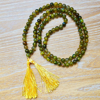 Shop beautiful hand crafted Natural Gemstone Mala Necklace - Prayer Beads at Magic Crystals. High quality Prayer Beads, Including Lapis Lazuli, Larvikite, Snowflake Obsidian, Howlite, Black Agate, Picture Jasper, Red Jasper, and Amethyst. Handcrafted with 108 beads, can be worn as a necklace or bracelet.