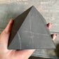 Shungite Pyramid helps for EMF Protection. Pyramid is Black Polished Authentic from Karelian for Anti-Radiation. Shungite Stone Figure from Karelia Energy Pyramid from Russia. Chakra Healing Stone, Block EMF's WIFI Radiation 5G at magiccrystals.com . Shop online with FREE SHIPPING AVAILABLE.