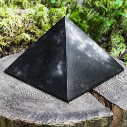 Shungite Pyramid helps for EMF Protection. Pyramid is Black Polished Authentic from Karelian for Anti-Radiation. Shungite Stone Figure from Karelia Energy Pyramid from Russia. Chakra Healing Stone, Block EMF's WIFI Radiation 5G at magiccrystals.com . Shop online with FREE SHIPPING AVAILABLE.