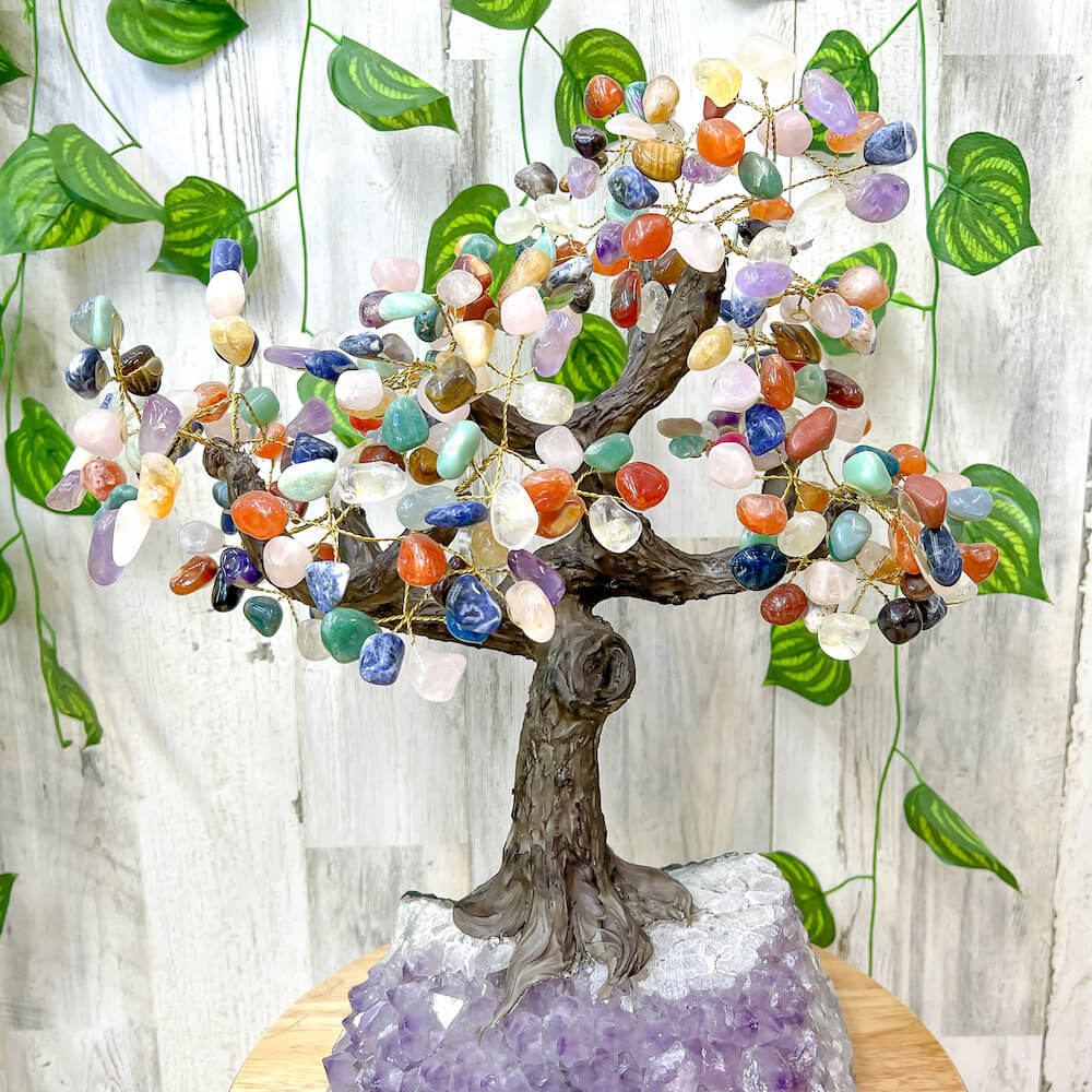 Looking for a large gemstone tree? Shop at Magic Crystals for a 18" - LARGE Multi Gemstone Tree on Amethyst Base with Authentic Crystals. Handmade Gemstone Tree w/Amethyst base. Druzy Amethyst Base. Materials Carnelian, Sodalite, Red Agate, Citrine, Green aventurine, Amethyst, Clear quartz, Rose Quartz and more.