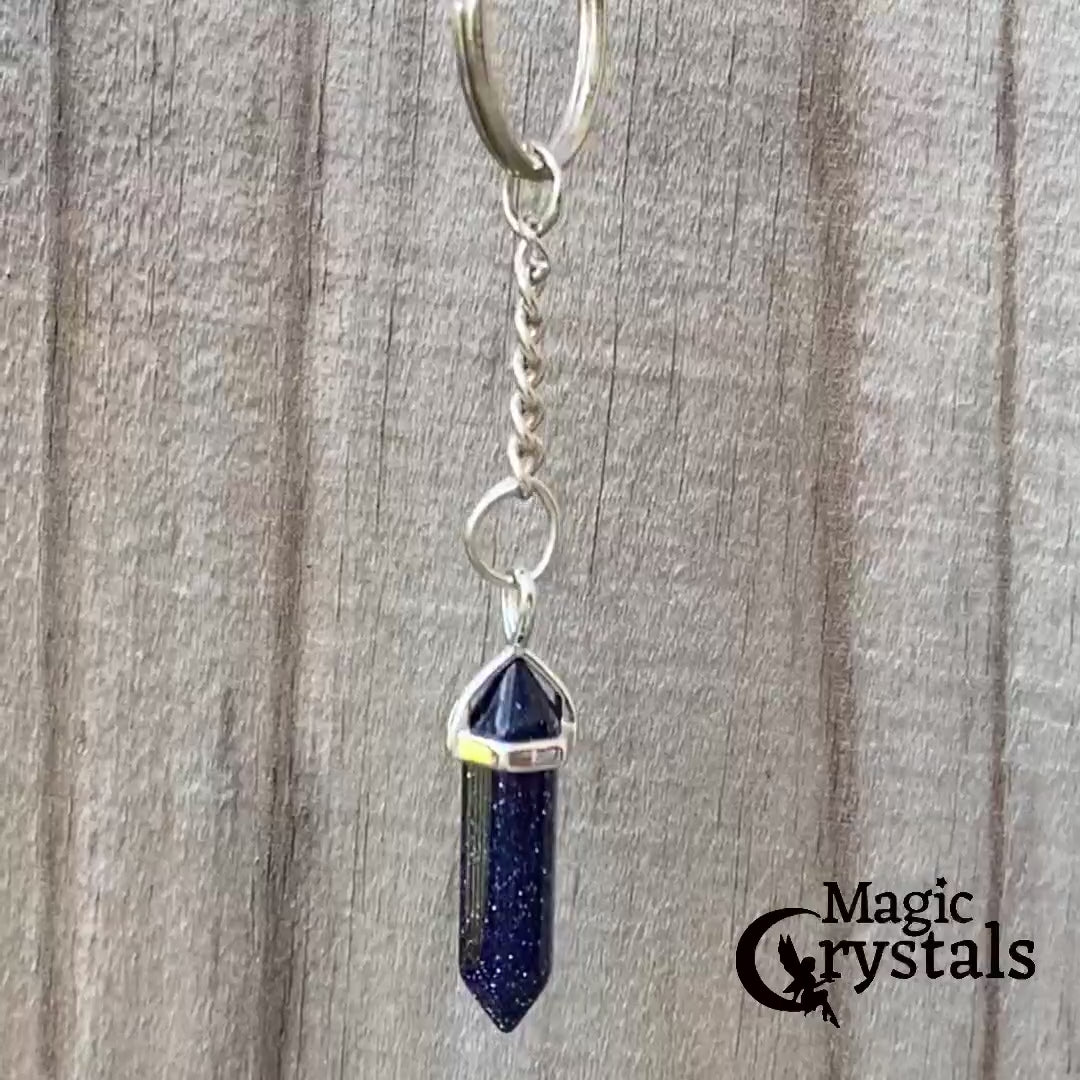 Blue Sandstone keychain. Shop at Magic Crystals for Crystal Keychain, Pet Collar Charm, Bag Accessory, natural stone, crystal on the go, keychain charm, gift for her and him. Blue Sandstone is a great for vitality. Blue Sandstone Natural Stone Keychain, Crystal Keychain, Blue Sandstone Crystal Key Holder. Blue gemstone