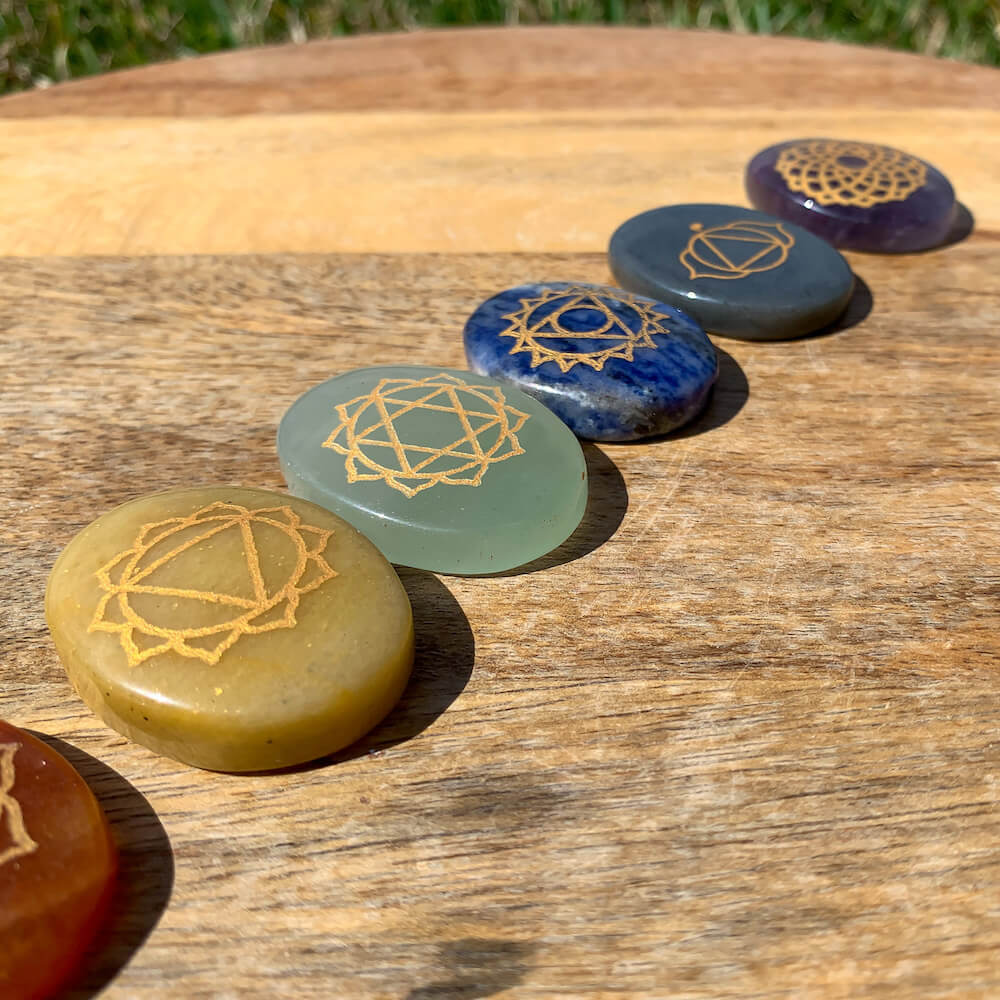 7 CHAKRAS ENGRAVED STONE PALM SET. All this powerful seven Chakra gemstone Collected from the different sources of mother nature. All 7 Chakra Gemstone Set. Seven Chakra crystals are ideal to stimulate your energy points known as the chakras. They bring balance, awareness, and spiritual growth.