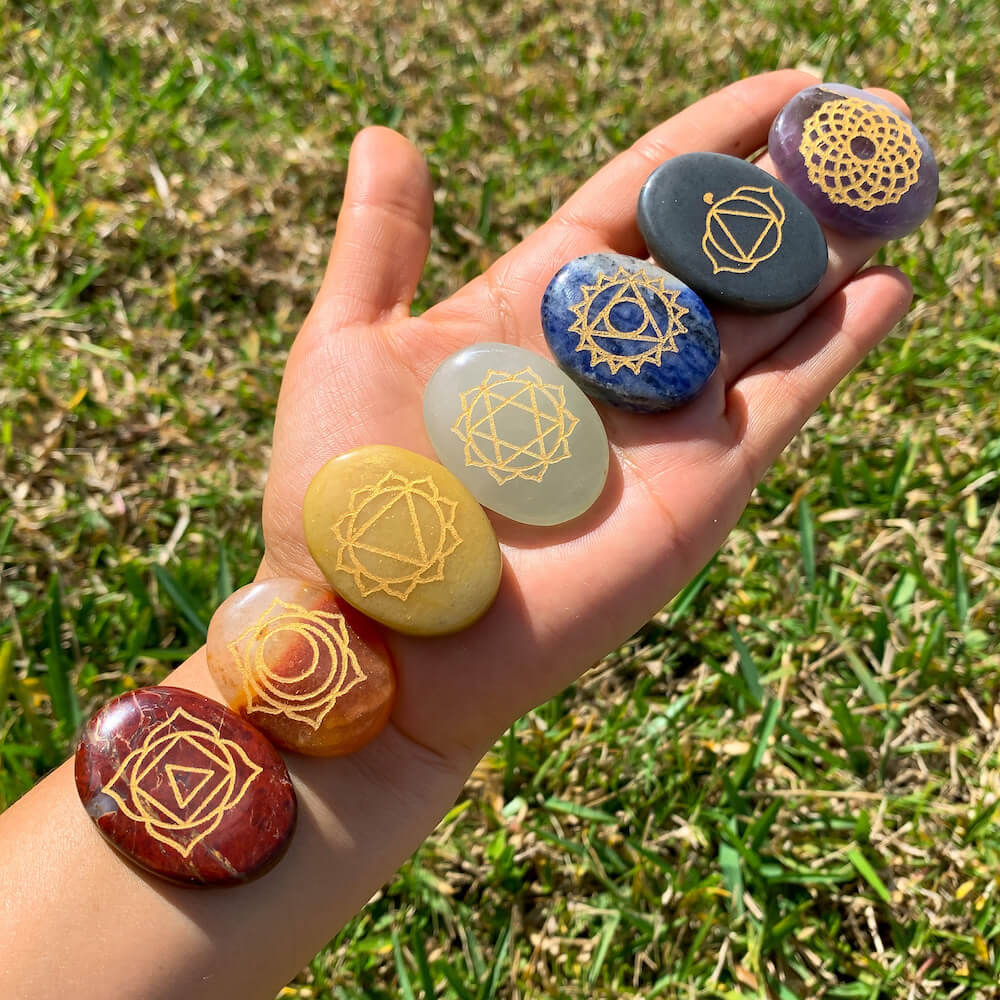 7 CHAKRAS ENGRAVED STONE PALM SET. All this powerful seven Chakra gemstone Collected from the different sources of mother nature. All 7 Chakra Gemstones. Seven Chakra crystals are ideal to stimulate your energy points known as the chakras. They bring balance, awareness, and spiritual growth.