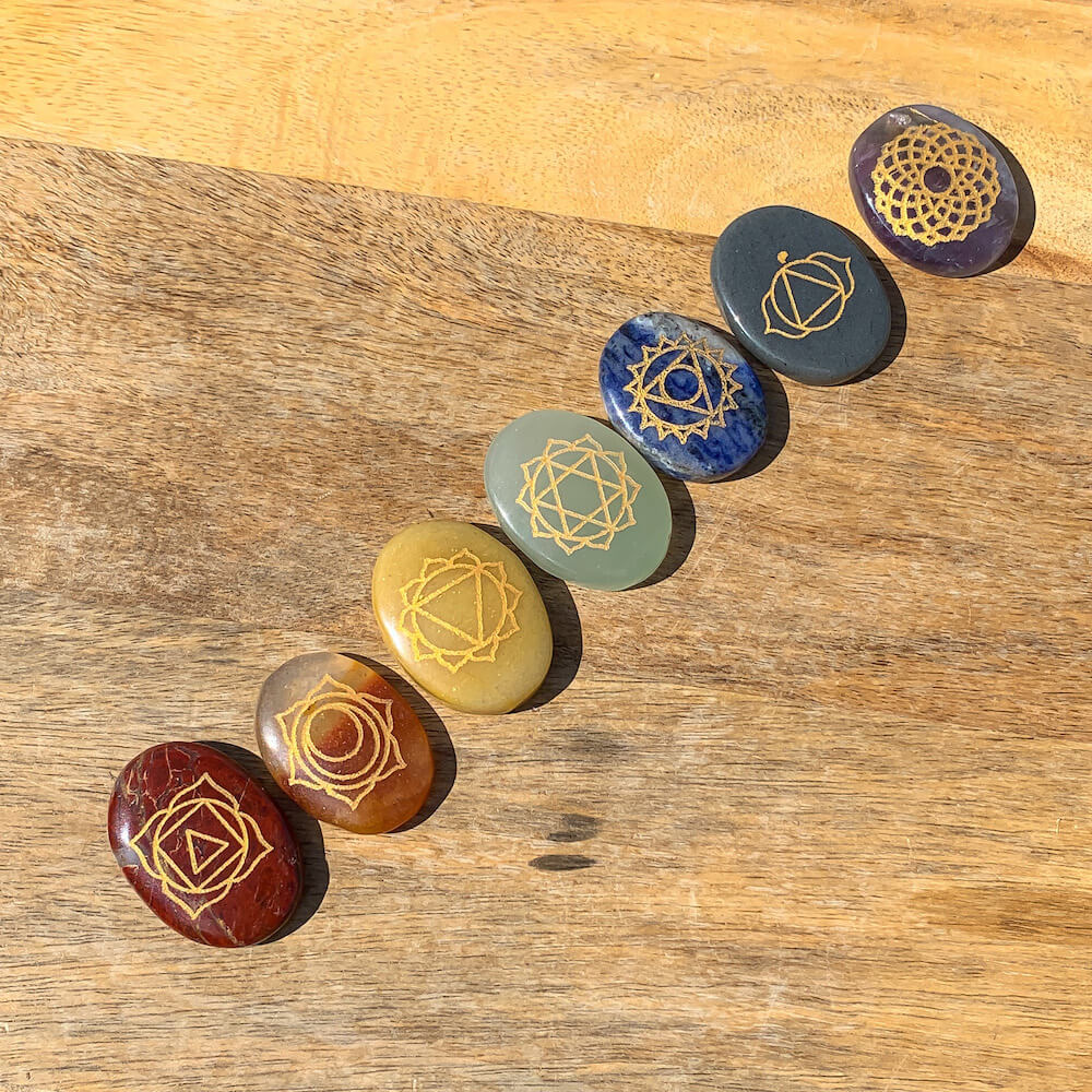 7 CHAKRAS ENGRAVED STONE PALM SET. All this powerful seven Chakra gemstone Collected from the different sources of mother nature. All 7 Chakra Gemstones. Seven Chakra crystals are ideal to stimulate your energy points known as the chakras. They bring balance, awareness, and spiritual growth.