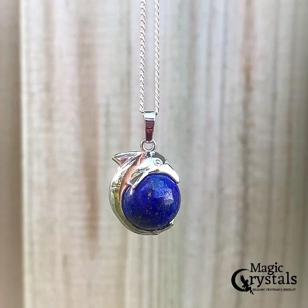  Lapis-Lazuli-Sphere-Dolphin-Pendant-Necklace. Dolphin Necklace - Elegant Ocean-Themed Jewelry for Women Dolphin Charm Necklace at Magic Crystals. Boho Style Jewelry with Natural Gemstones. Stone Carved Dolphin Necklace Pendant, Beach Surf Ocean Boho Gemstone Whale Fairtrade Gift. These beautiful stone necklaces are all hand carved.