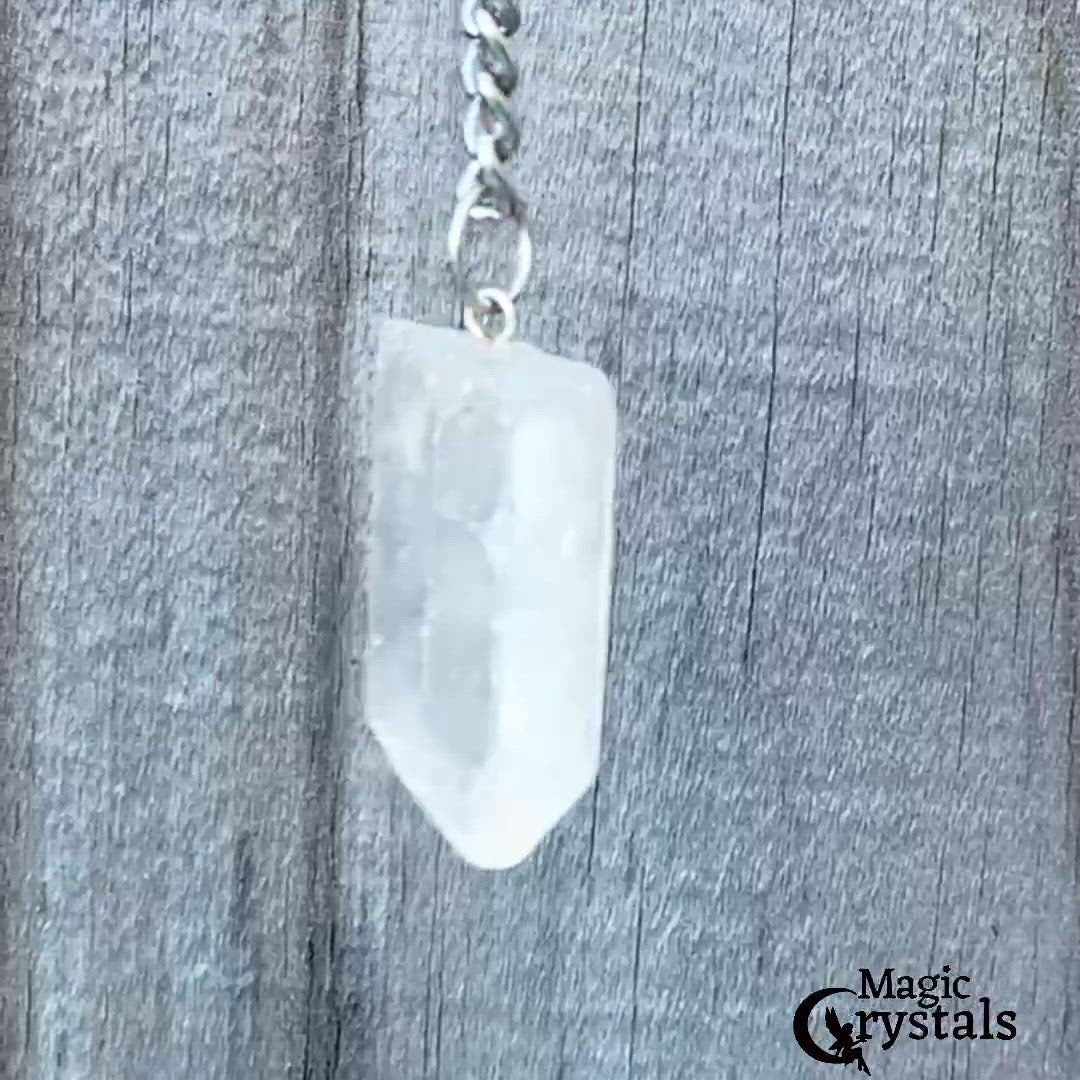 Clear Crystal Quartz keychain. Shop at Magic Crystals for Crystal Keychain, Pet Collar Charm, Bag Accessory, natural stone, crystal on the go, keychain charm, gift for her and him. Clear Crystal Quartz is a great for all hear. Clear Crystal Quartz Natural Stone Keychain, Crystal Keychain, Clear Crystal Quartz Crystal Key Holder. White clear gemstone.