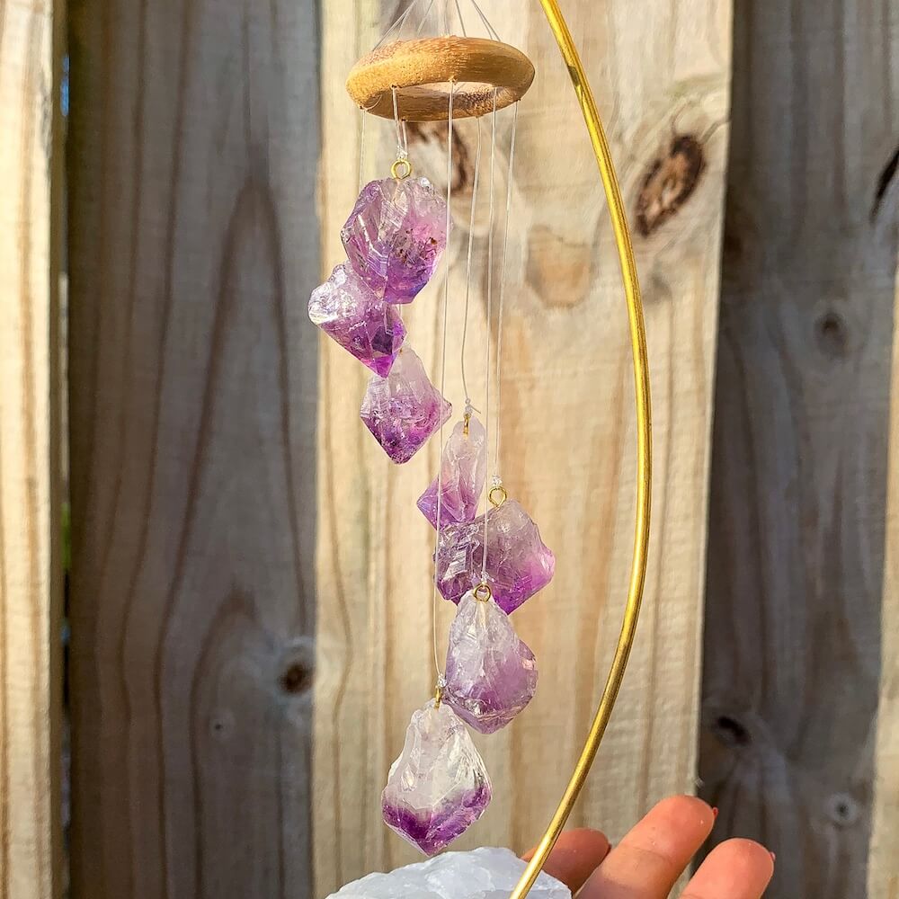 This beautiful 7 crystal point desk chime is made with genuine amethyst crystals draping from a wooden ring. Amethyst Points Desk Chime - Amethyst Home Decor at Magic Crystals with FREE SHIPPING available. perfect for office decor, crystal wind chime, crystal decor. Chime Mobile, Wind Catcher, Spiritual Art.