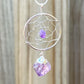 Gorgeous silver plated Amethyst Dreamcatcher Silver Necklace adorned with an Amethyst crystal bead and a raw Amethyst crystal hanging from the bottom. Shop at Magic Crystals for Amethyst Jewelry, Healing Crystals, and Stones. Perfect gift for someone or to wear every day. Boho Jewelry, February Birthstone.