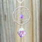 Gorgeous silver plated Amethyst Dreamcatcher Silver Necklace adorned with an Amethyst crystal bead and a raw Amethyst crystal hanging from the bottom. Shop at Magic Crystals for Amethyst Jewelry, Healing Crystals, and Stones. Perfect gift for someone or to wear every day. Boho Jewelry, February Birthstone.