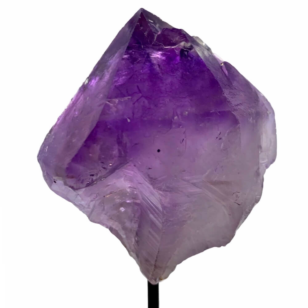 Shop at Magic Crystals for Amethyst Point on Stand. Magiccrystals.com is the best when Looking for One Rough Amethyst Metal Stand, Amethyst Chunk on Stand, Point on Stand Pin, Amethyst Protect Stone, Rough Amethyst, Raw purple stones. Shop for our genuine gemstones. FREE SHIPPING AVAILABLE!