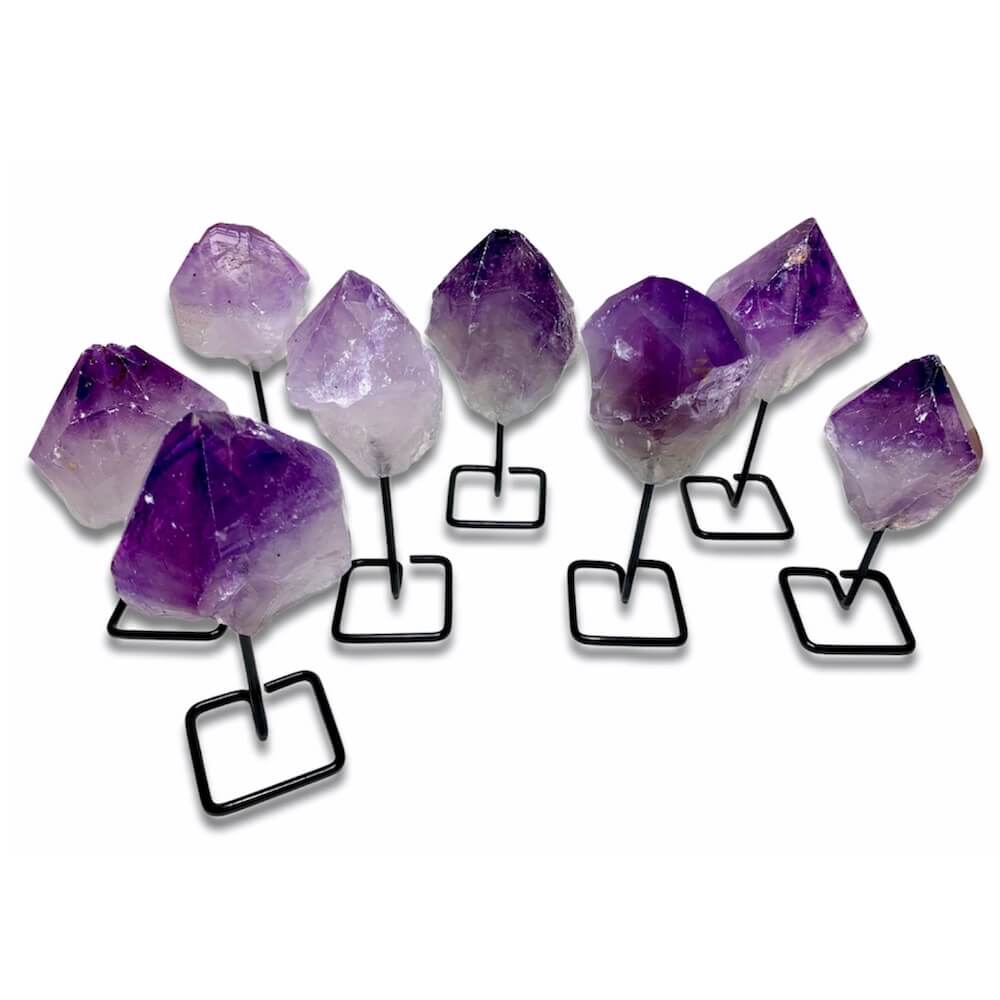 Shop at Magic Crystals for Amethyst Point on Stand. Magiccrystals.com is the best when Looking for One Rough Amethyst Metal Stand, Amethyst Chunk on Stand, Point on Stand Pin, Amethyst Protect Stone, Rough Amethyst, Raw purple stones. Shop for our genuine gemstones. FREE SHIPPING AVAILABLE!