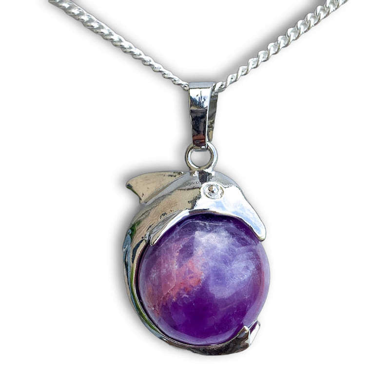 Amethyst-Sphere-Dolphin-Pendant-Necklace. Dolphin Necklace - Elegant Ocean-Themed Jewelry for Women Dolphin Charm Necklace at Magic Crystals. Boho Style Jewelry with Natural Gemstones. Stone Carved Dolphin Necklace Pendant, Beach Surf Ocean Boho Gemstone Whale Fairtrade Gift. These beautiful stone necklaces are all hand carved.