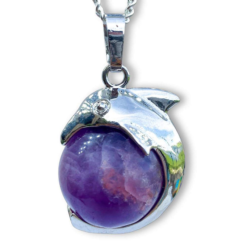    Amethyst-Sphere-Dolphin-Pendant-Necklace. Dolphin Necklace - Elegant Ocean-Themed Jewelry for Women  Dolphin Charm Necklace at Magic Crystals. Boho Style Jewelry with Natural Gemstones. Stone Carved Dolphin Necklace  Pendant, Beach Surf Ocean Boho Gemstone Whale Fairtrade Gift. These beautiful stone necklaces are all hand carved.