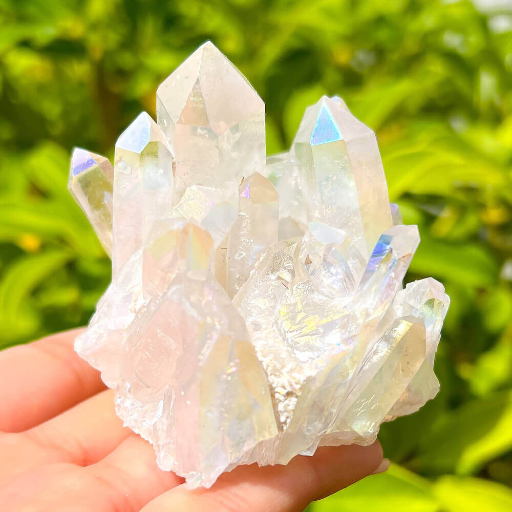 Looking for an Angel Aura Quartz Crystal Cluster Healing Crystal? We have a wide variety of single points, Rainbow Quartz, Aura Crystal Cluster, Rainbow Titanium Crystal at Magic Crystals. Magiccrystals.com Aura Quartz will help you enjoy a deeper spiritual experience by connecting you to your spiritual guides.
