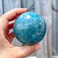 Looking for a Blue Apatite Sphere? Shop for Natural Blue Apatite Sphere- B at Magic Crystals. We carry the very best in unique, handmade Blue Apatite sphere, Blue Apatite Crystal ball. Quartz Crystal Ball, Home Decoration, energy crystal. Apatite assists with MOTIVATION and MANIFESTATION. Gemini stone.