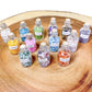 Gemstone Crystal Bottle - Stone Bottle Set - Gemstone Chips - Tarot Gemstone Bottle, Crystal Gemstone Bottle - gemstone crystal chips. The listing is for one Crystal Bottle. Crystals included Peridot, Blue Topaz, Carnelian, Turquoise, Moonstone, Rose Quartz, Tigers Eye, Quartz, Amethyst, Aventurine, Garnet, Citrine.