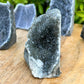 Cut base Brazilian Black Amethyst Church Cathedral Sparkly Druze Raw Crystal Cluster at Magic Crystals. This gemstone is a February Birthstone perfect for Third Eye Chakra and Crown. This gemstone helps for Spirituality and Wisdom. Natural Amethyst offers FREE SHIPPING and the best quality gemstones. Black-Amethyst-Cut-Base