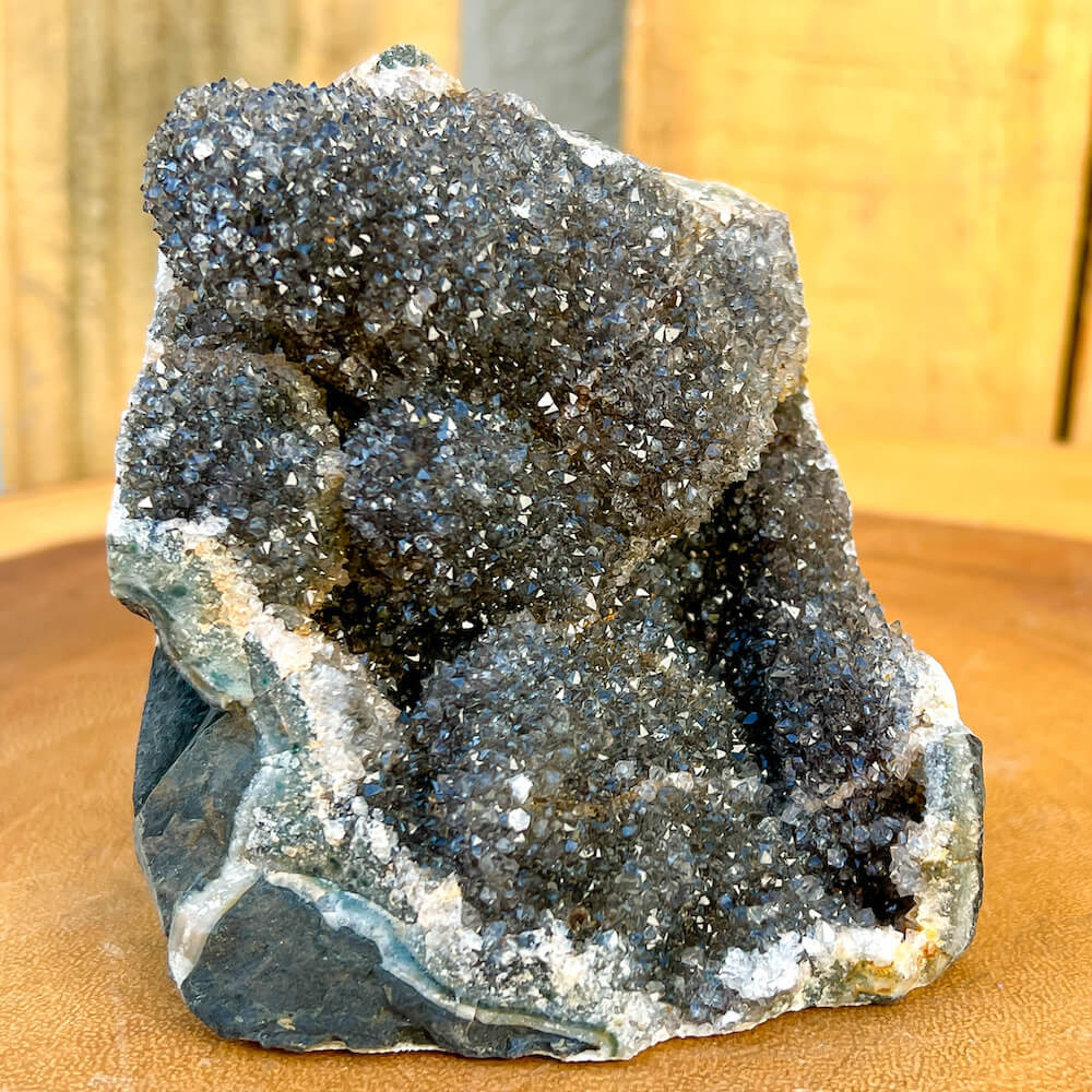 Free-standing Brazilian Black Amethyst Church Cathedral Sparkly Druze Raw Crystal Cluster at Magic Crystals. This gemstone is a February Birthstone perfect for Third Eye Chakra and Crown. This gemstone helps for Spirituality and Wisdom. Natural Amethyst offers FREE SHIPPING and the best quality gemstones.